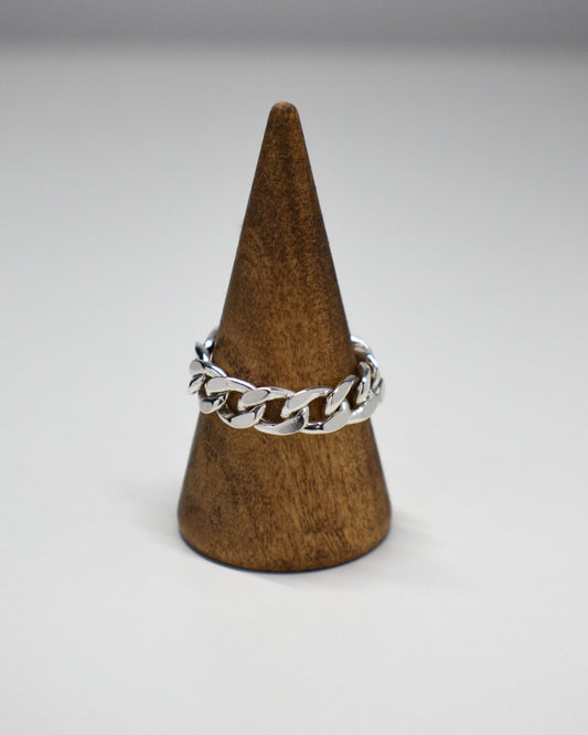 Sterling Silver Heavy Chain ring on a wooden display.